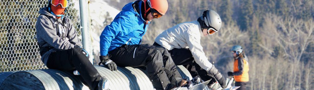 Strapping on snowboards